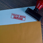 You've,Been,Served,Text,On,Document,Above,Brown,Envelope.