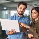 Two,Busy,lawyers,Working,In,Office,With,Computer, looking at litigation software