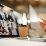 attorney sitting at computer screen during a remote deposition