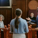 lawyer standing up in courtroom giving an objection during a deposition