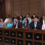 A group of jurors sitting in the courtroom