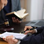 Attorneys preparing for a 30b6 deposition.