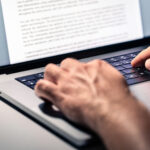 Attorney typing a preservation letter.